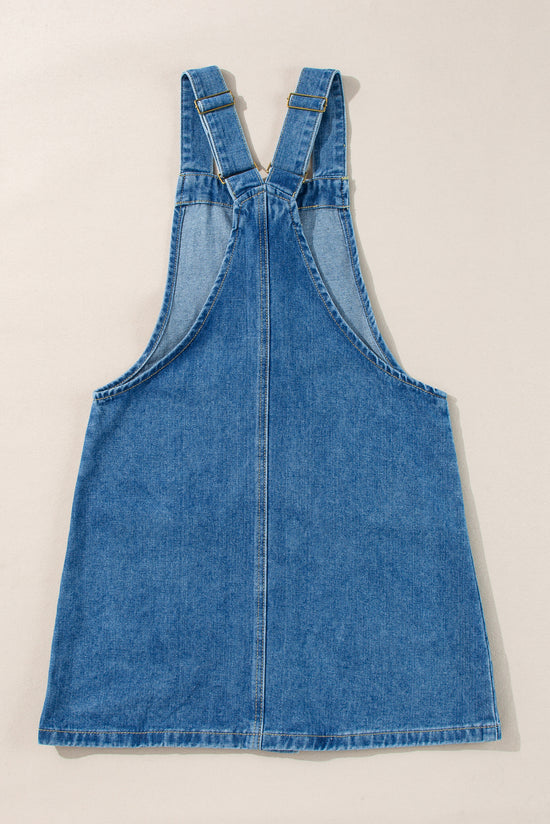 Mini-twilled blue jeans with large buttoned straps with pockets on the front