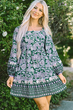 Green dress with floral print and border *