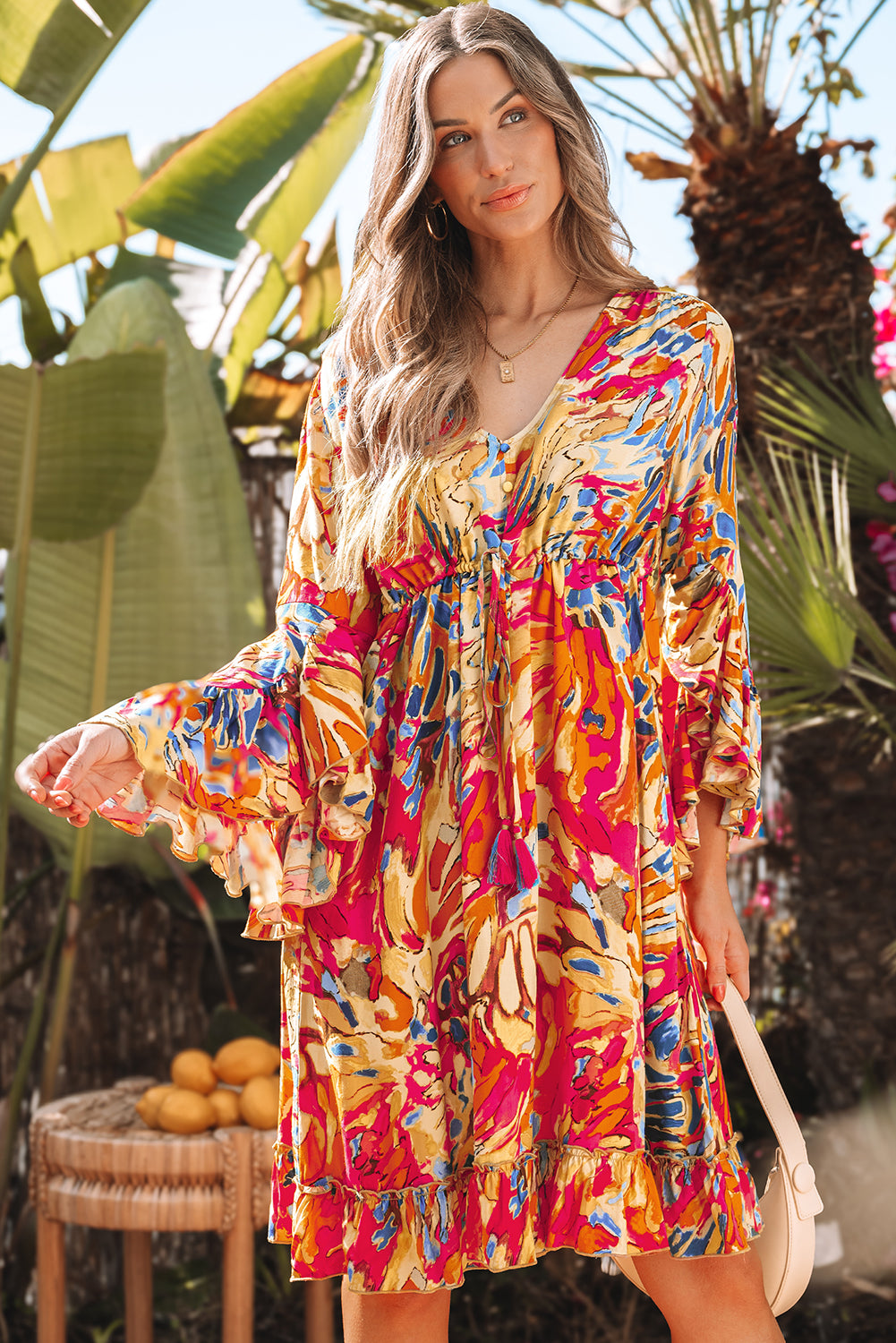 Robe fluide rose à manches évasées *