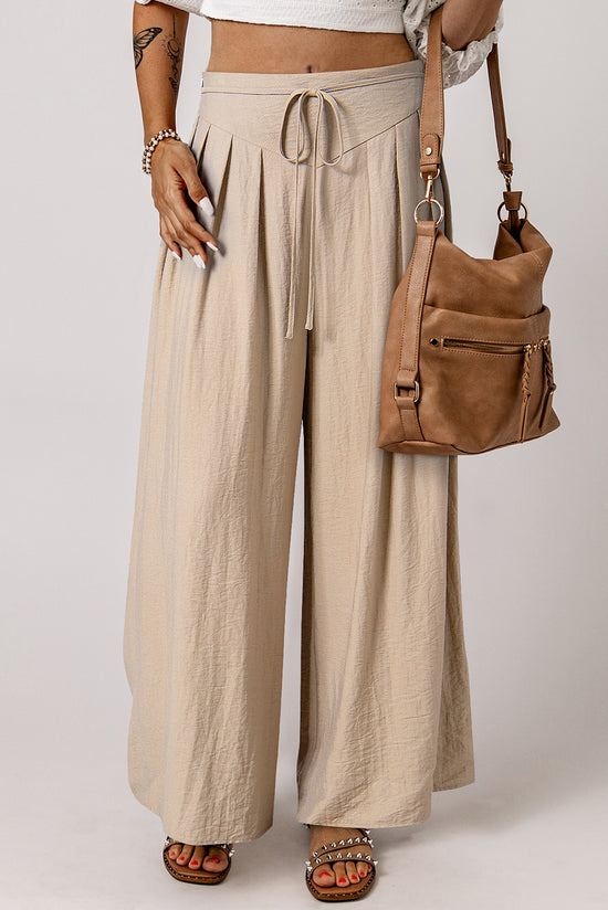 Large pleated leg relaxed pants with beige tightening cord