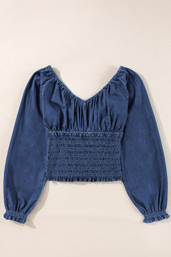 Smocked dark blue jeans blouse with ruffles and puffy sleeves in V -neck