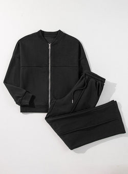 Ensemble veste zippée noire à coutures unies et pantalon à taille avec cordon de serrage