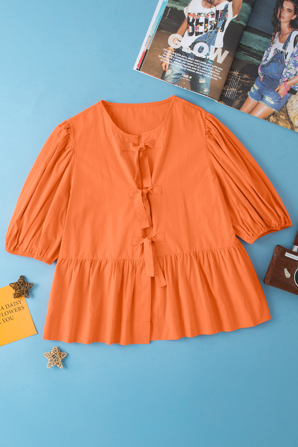 Blouse à peplum à manches courtes nouées orange nouée à l'orange nouée