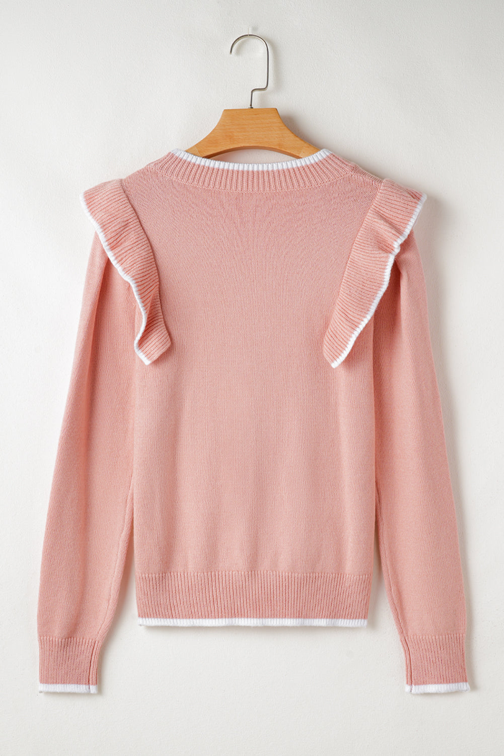 Pull à manches longues et bordure côtelée avec nœud papillon et volants rose clair