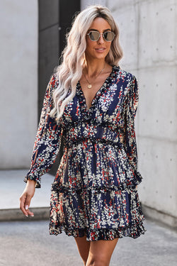 Blue floral dress with ruffles and open back