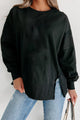 Black sweatshirt with exposed seams, dropped shoulders, round neck, slits