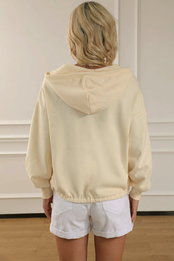 Beige zip-up hoodie with kangaroo pocket and ribbed trim