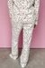 White pajama set with long sleeves and pants with contrasting and star piping