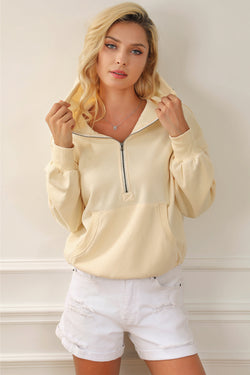 Beige zip-up hoodie with kangaroo pocket and ribbed trim