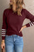 United knitting sweater with red striped sleeves