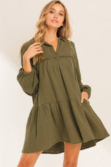 Green flared dress with frayed edging, split collar, puffed sleeves