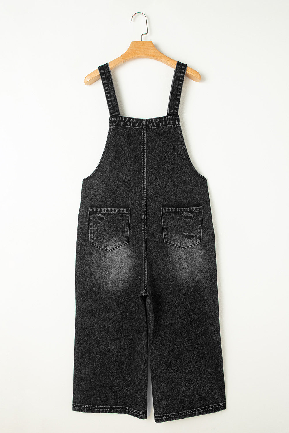 Salopette en jean noir effet vieilli avec poche à bavette et jambe large