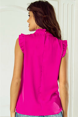 Hot pink pleated sleeveless top with high neck and ruffle trim