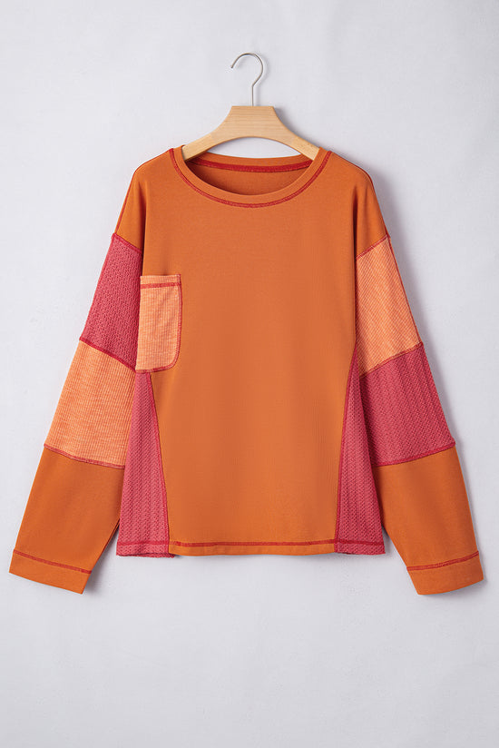 Haut orange en tricot texturé avec bloc de couleurs *