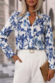 Elegante blusa con cuello con muescas y estampado floral azul floral