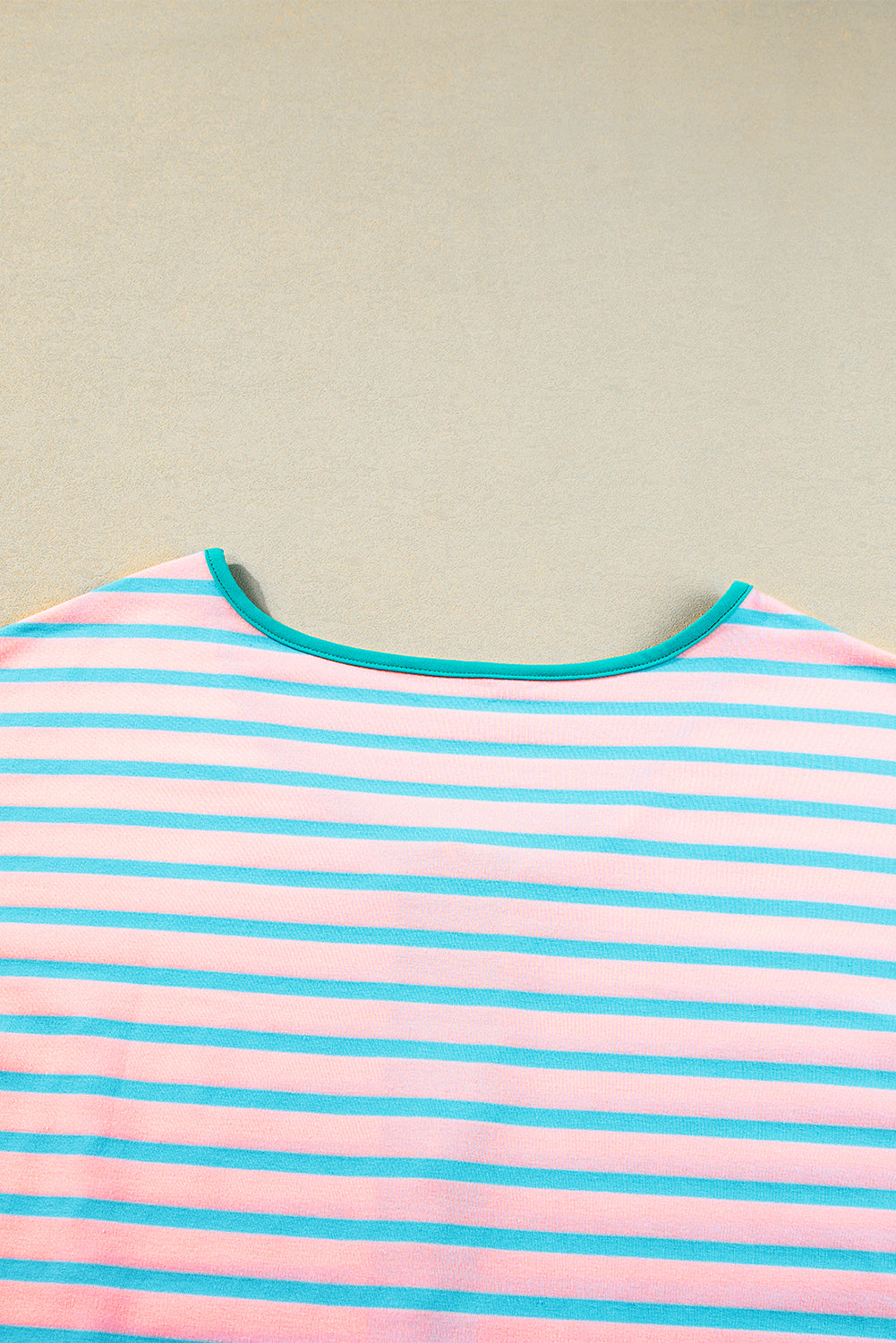 Short-sleeved and half-zip top with pink contrast stripes