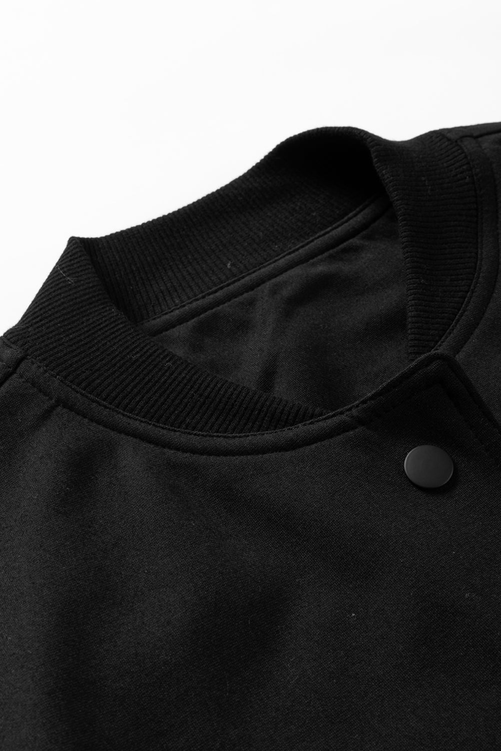 Schwarze große Taschen Baseballkragenjacke