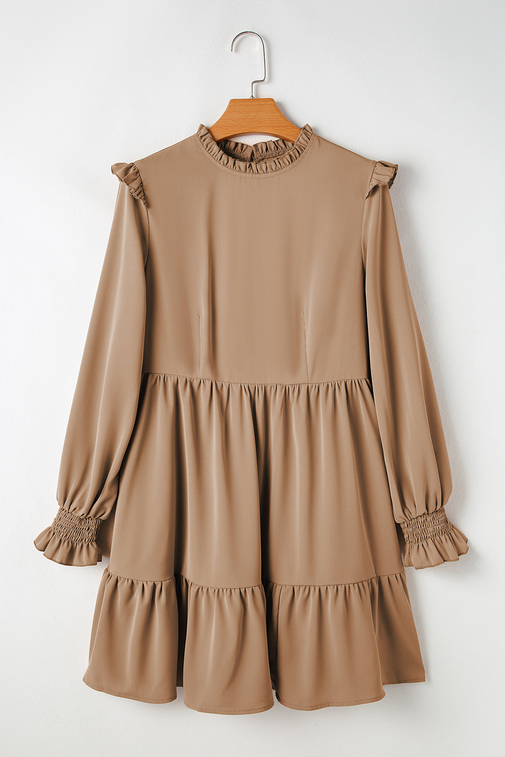 Tiered dress with ruffled shoulders and ruffled collar in light French beige