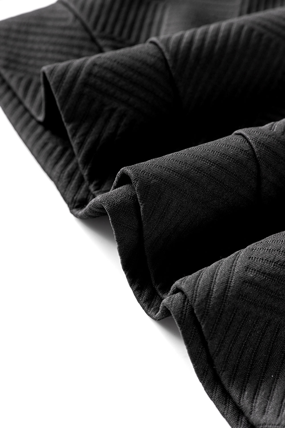 Boutons asymétriques noirs détaillé le sweat texturé haut de cou