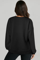 Sweat-shirt noir uni à col rond et ourlet haut et bas