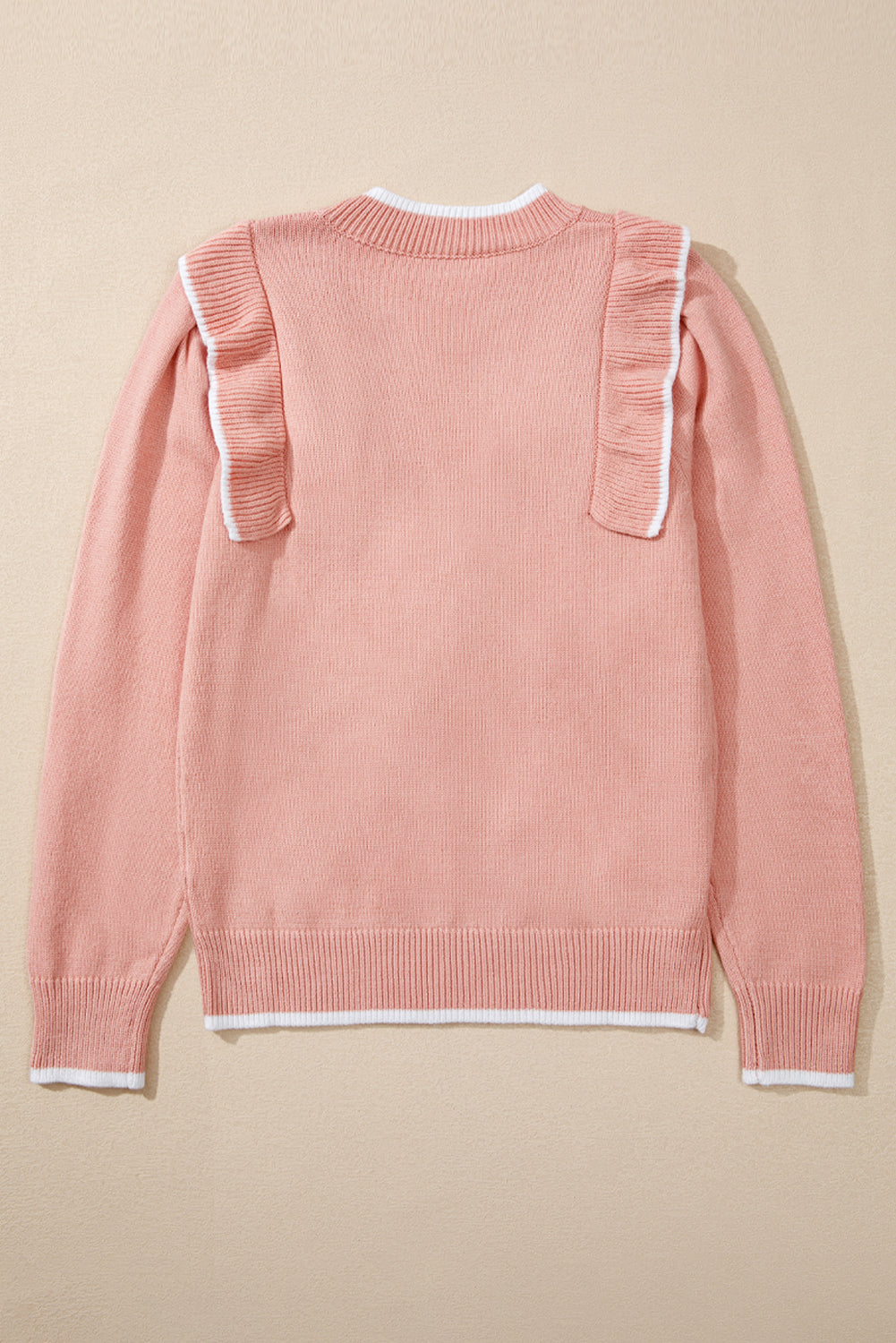 Pull à manches longues et bordure côtelée avec nœud papillon et volants rose clair