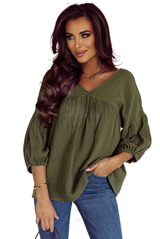 Textured green babydoll blouse in V -collar and bracelet sleeves