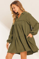 Green flared dress with frayed edging, split collar, puffed sleeves