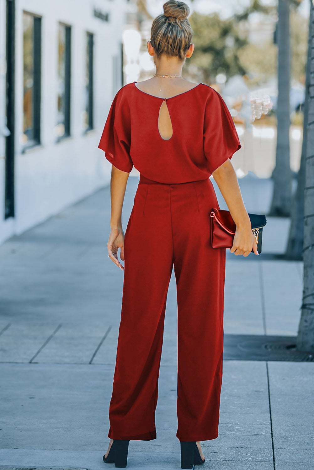 Bright red belted wide leg jumpsuit