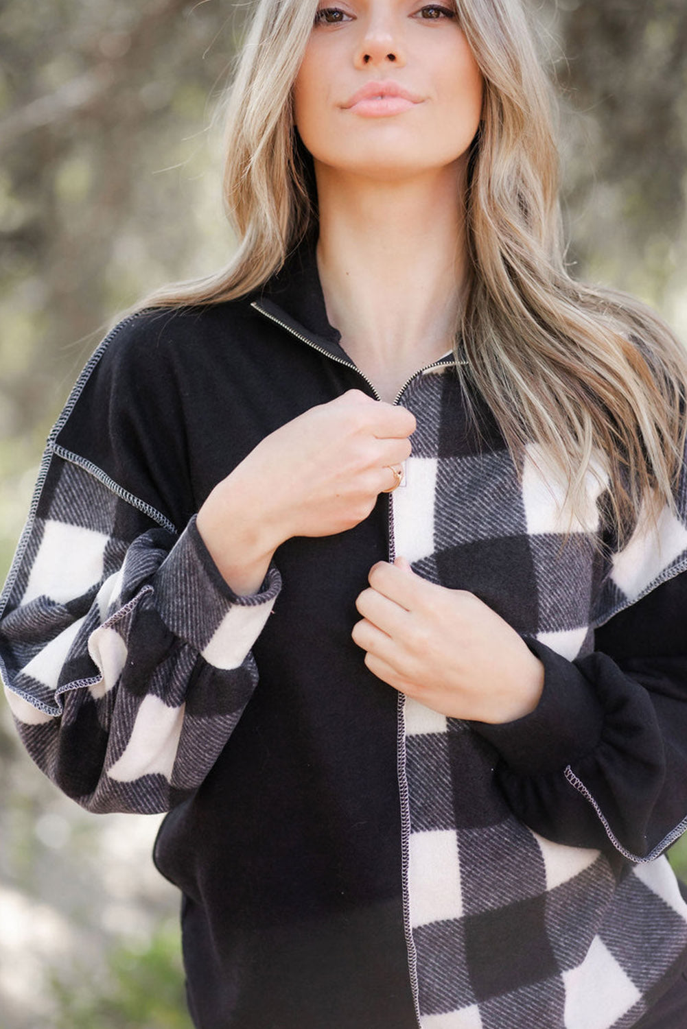 Black checkerboard patchwork collared top with exposed seams