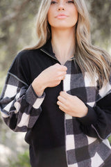 Black checkerboard patchwork collared top with exposed seams