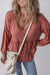 Puffy sleeve blouse and V -collar with tuffled ruffled in a solid mineral red colored