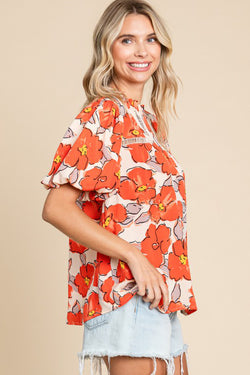 Orange loose sleeve blouse and flying collar and floral pattern