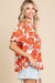 Orange loose sleeve blouse and flying collar and floral pattern