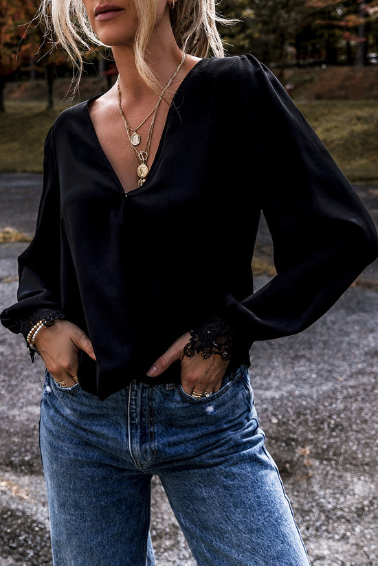 Black V -neck blouse and crochet lace cuffs