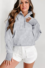 Light gray sweatshirt with stand-up collar and kangaroo pocket with quarter-turn zip
