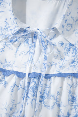 Sky blue flower blouse with 3/4 sleeves and tied collar