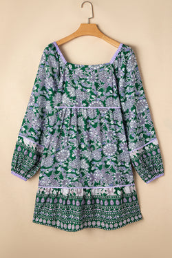 Green dress with floral print and border *