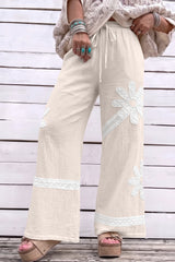 Pantalon large blanc en coton à dentelle florale