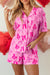 Pink pajama set with half-long sleeve shirt and node print shorts