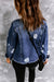 Blue distressed denim jacket with lapels and raw hem buttons