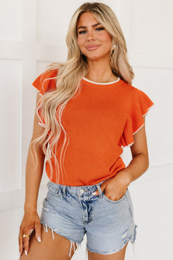 Knitted top with ruffled sleeves and contrasting trim in russet orange