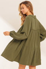 Green flared dress with frayed edging, split collar, puffed sleeves