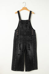 Salopette en jean noir effet vieilli avec poche à bavette et jambe large