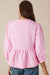 Striking pink blouse and bow tie on the front, round neck, puffy sleeves