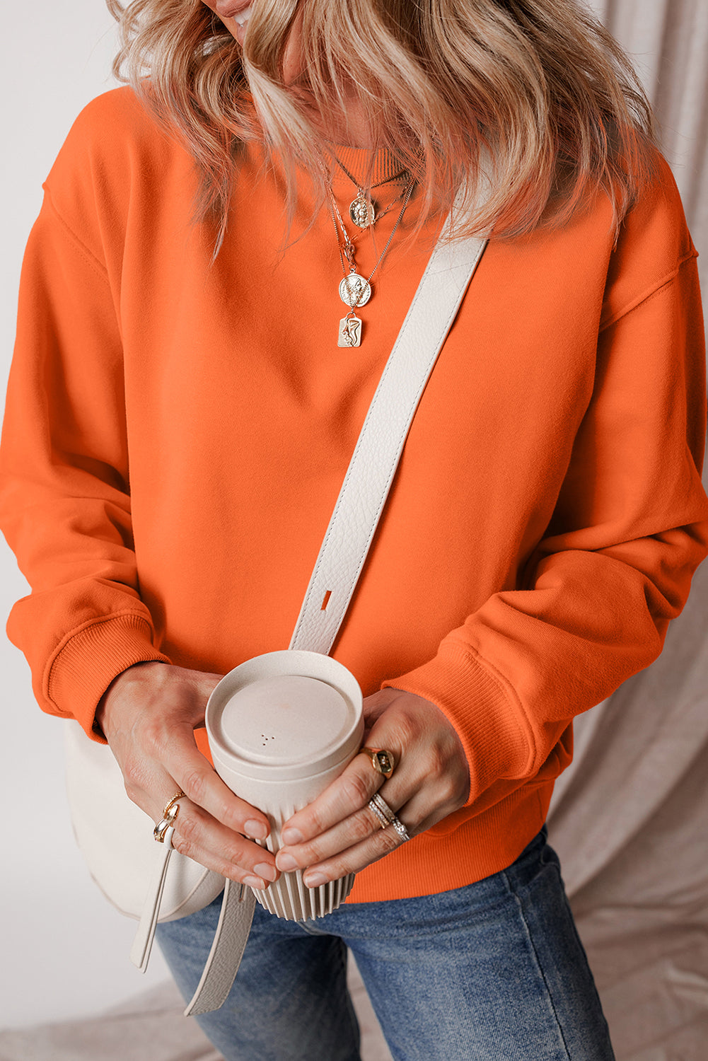 Sudadera en tela de esponja con hombros caídos y forro en united anaranjado de color rojo naranja