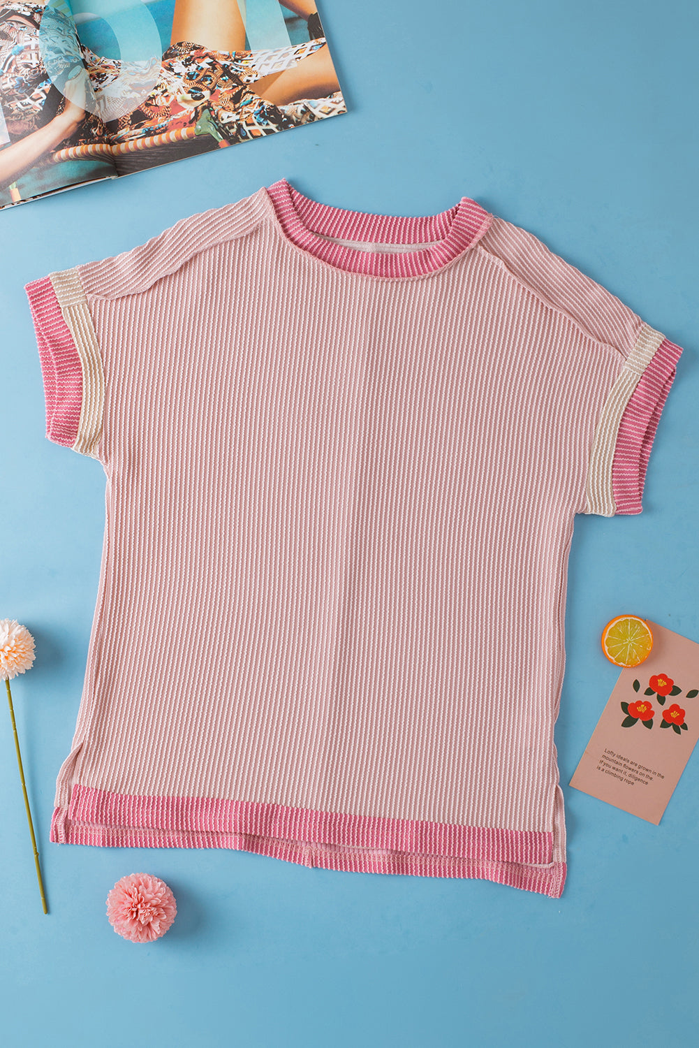 Light pink t-shirt with round neck and contrasting textured border