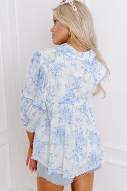 Sky blue flower blouse with 3/4 sleeves and tied collar