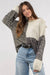 Neutral color block black sweater with tie at the back