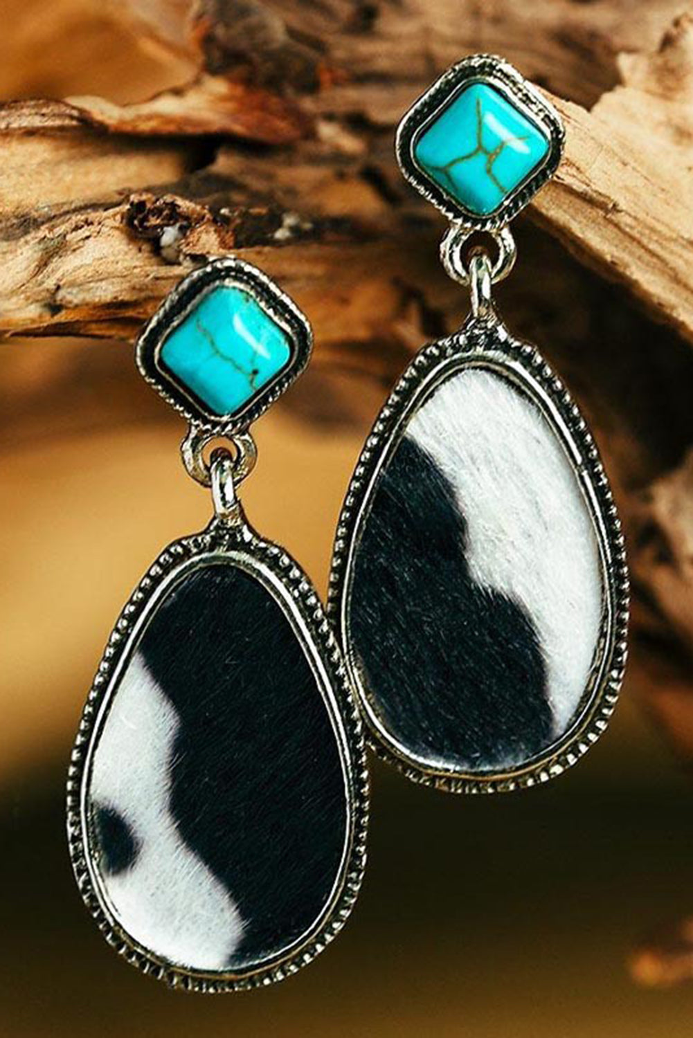 Boucles d'oreilles pendantes turquoise à imprimé vache noire