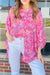 Sleeveless tunic shirt with sleeve and abstract pink print